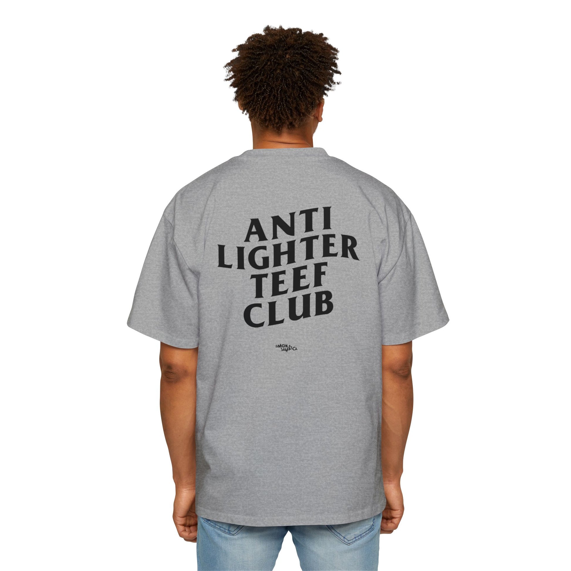 White oversized t-shirt featuring bold black text on the back reading "Anti Lighter Teef Club," with a relaxed fit and 100% cotton fabric for comfort and style.